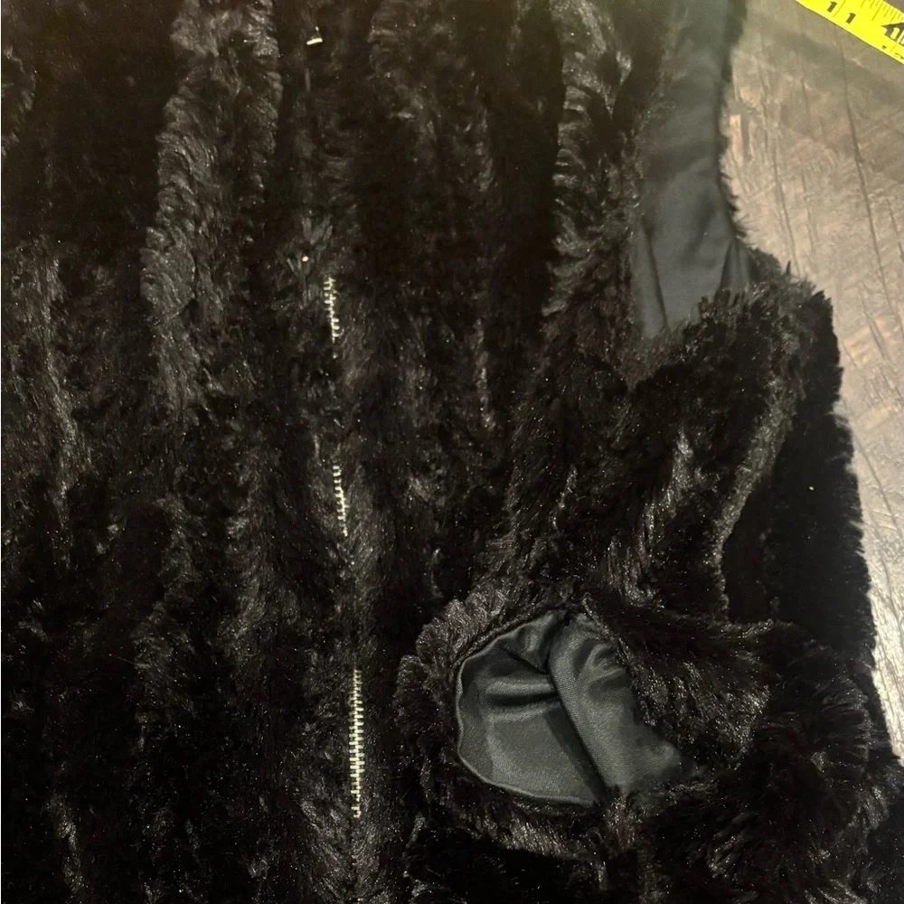 Aqua Bloomingdales  Black Faux Fur Vest size small. Zip up with pockets